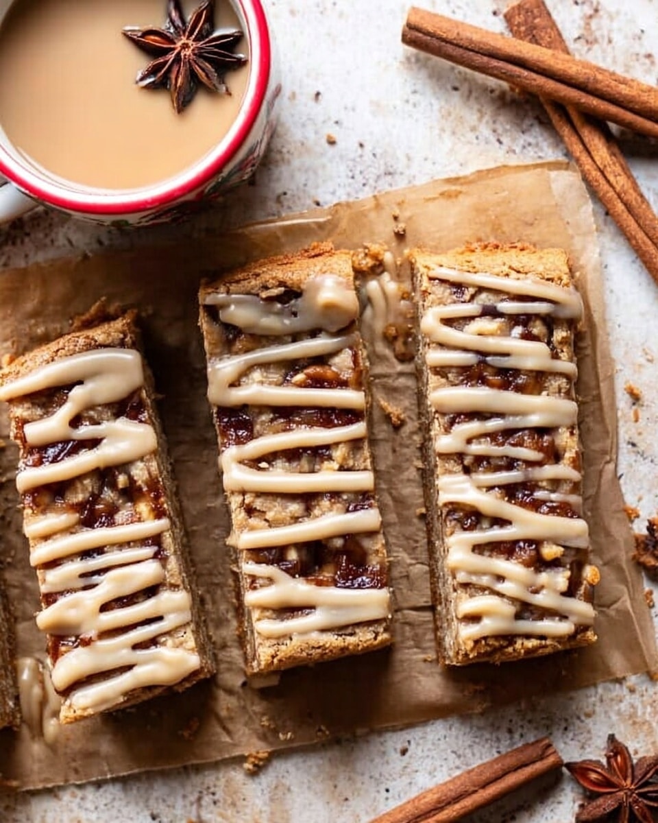The image shows a stack of three thick, square bars with a light brown, crumbly texture, each topped with thin white icing drizzles that create a wavy pattern on the surface, along with visible small chunks of what appear to be nuts or fruit embedded inside. The pile is placed on a wooden surface with a small piece broken off lying in the front, showing the inside texture. Part of a white cup with a red rim is visible on the right side, and a woman's hand is holding the top bar slightly above the stack. The background includes a blurred cinnamon stick in the foreground and a white marbled textured surface behind. photo taken with an iphone --ar 4:5 --v 7